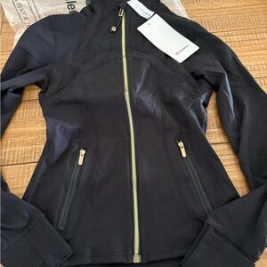 Lululemon Define Jacket in black with gold hardware